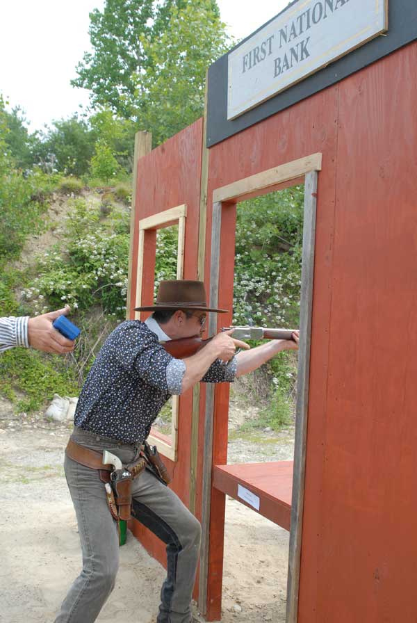 Jimmy Spurs shooting rifle.